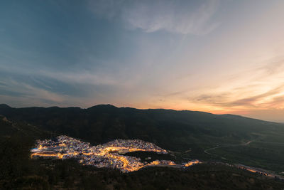 High angle view of city against sky during sunset