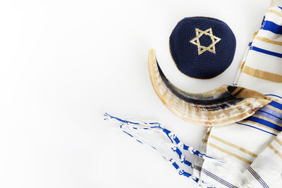 High angle view of hat on table against white background