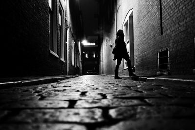 Rear view of man walking on street