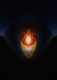 Close-up of illuminated lighting equipment against black background