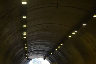 Low angle view of illuminated tunnel