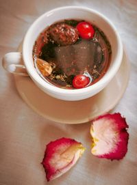 High angle view of strawberries in bowl on table