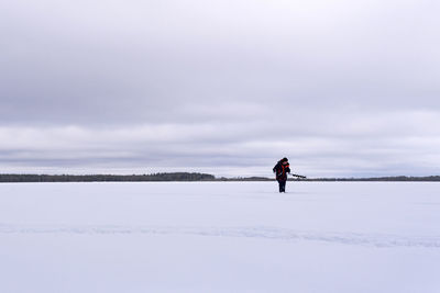 Man on snow against sky