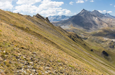 Hike between the tovière and the col de fresse on a path with a view of the grande motte in tignes