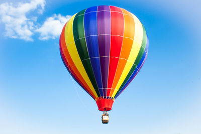 Low angle view of hot air balloon against blue sky