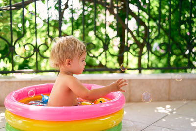 Boy sitting in park