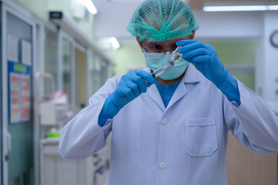 Midsection of person wearing mask