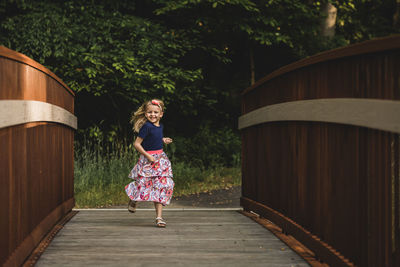 Portrait of smiling girl on bridge