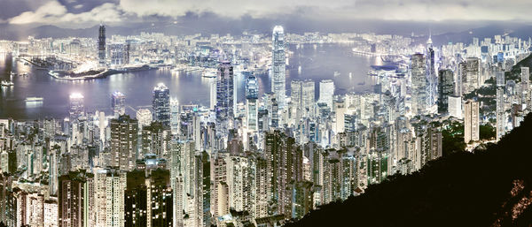 High angle view of modern buildings in city against sky