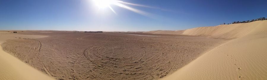 Scenic view of desert against clear sky