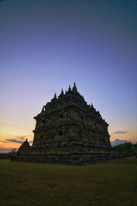 Ancient temple against sky during sunset