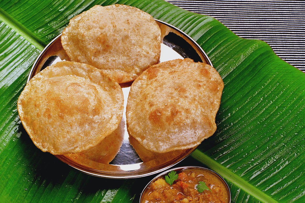 CLOSE-UP OF FOOD ON TABLE WITH LEAVES