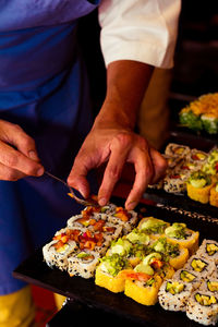 Midsection of man preparing food