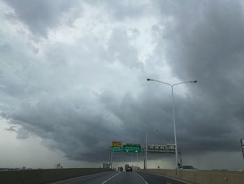 Road against cloudy sky