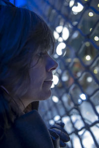 Close-up portrait of young woman looking away