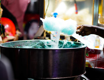 Midsection of man preparing food