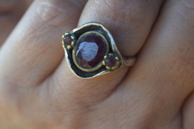 Close-up of hand holding ring