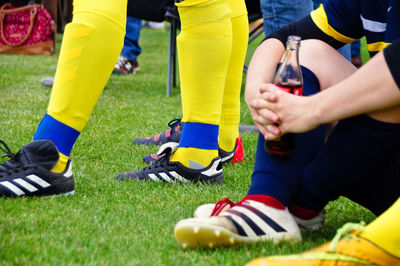 Low section of players on soccer field
