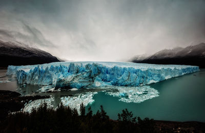 Scenic view of frozen lake against sky