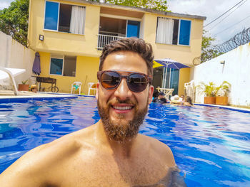 Portrait of young man in swimming pool