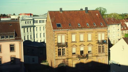 Buildings in town against sky