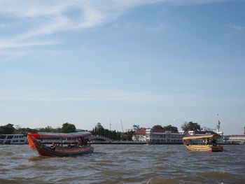 Boats sailing in sea