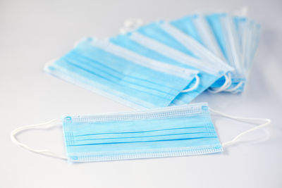 High angle view of blue plastic on table against white background