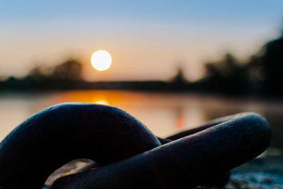 Close-up of sea against sky during sunset