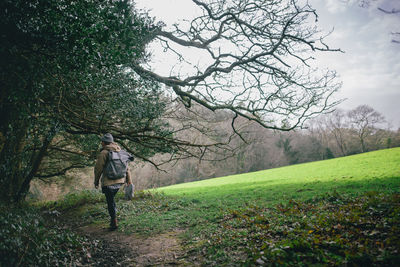 Full length of woman standing on grassy field