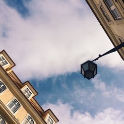 Low angle view of building against cloudy sky