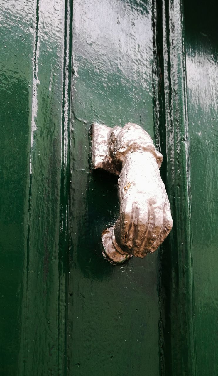 CLOSE-UP OF CLOSED DOOR OF METAL GATE