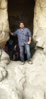 Full length of man standing on rock
