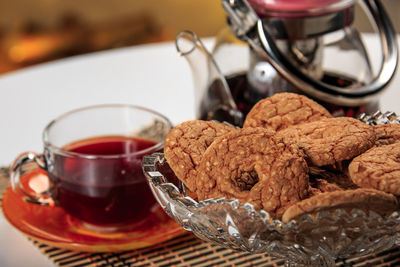 Close-up of cookies in glass on table