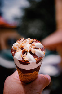 Close-up of hand holding ice cream