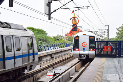 Delhi metro train arriving at jhandewalan metro station in new delhi, india, asia, public metro rail