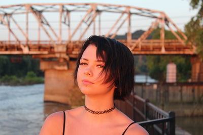 Portrait of beautiful woman at bridge