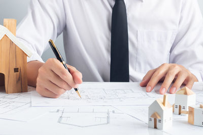 Cropped image of man working on table