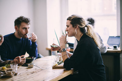 Young couple sitting on table