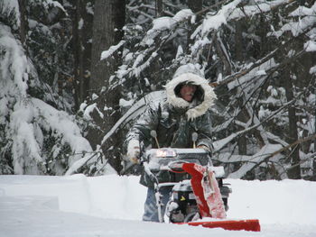 Man using snow blower