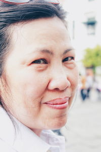 Close-up portrait of smiling young woman