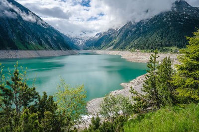 Scenic view of lake and mountains against sky