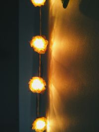 Close-up of lit light bulb