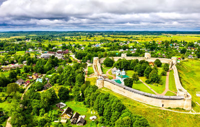 High angle view of trees and buildings against sky