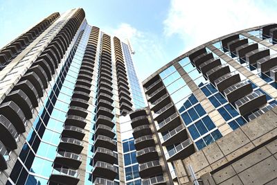 Low angle view of modern buildings against sky