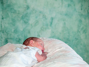 Boy sleeping on bed