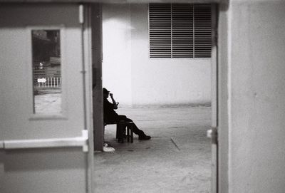 Man in corridor of building