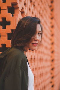 Portrait of a young woman standing outdoors