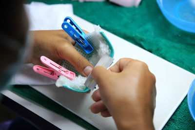 Cropped hands working at table