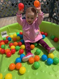 Full length of cute boy playing with ball
