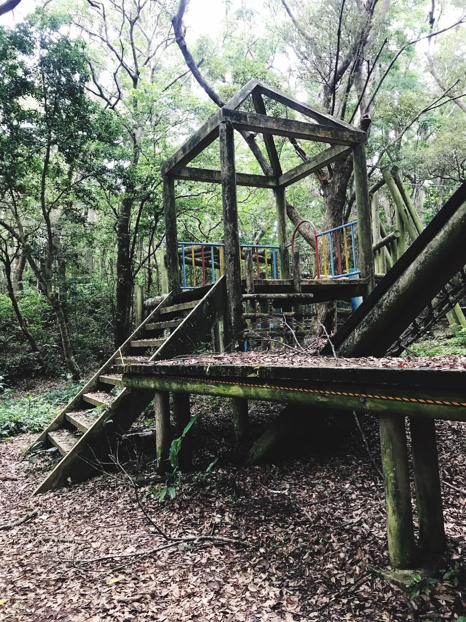 ABANDONED METAL STRUCTURE IN FOREST